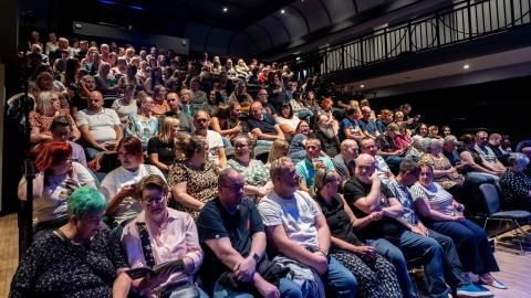 Audience members seated in The Studio, Bradford.