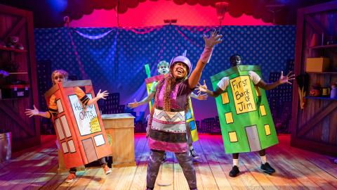 Actors on the set of Dog Man The Musical dress as buildings.