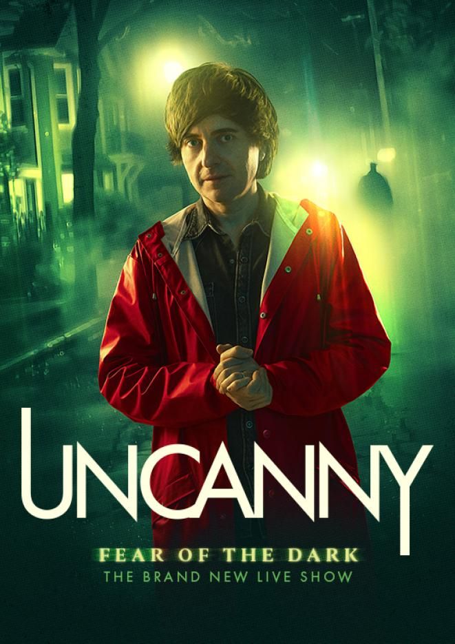 Paranormal expert Danny Robbins stands wearing a red coat against a green smokey background with white text below that reads Uncanny.
