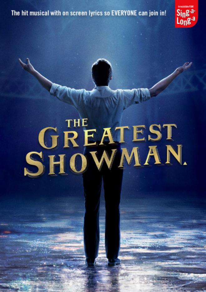 A man with his back to the camera and arms in the air