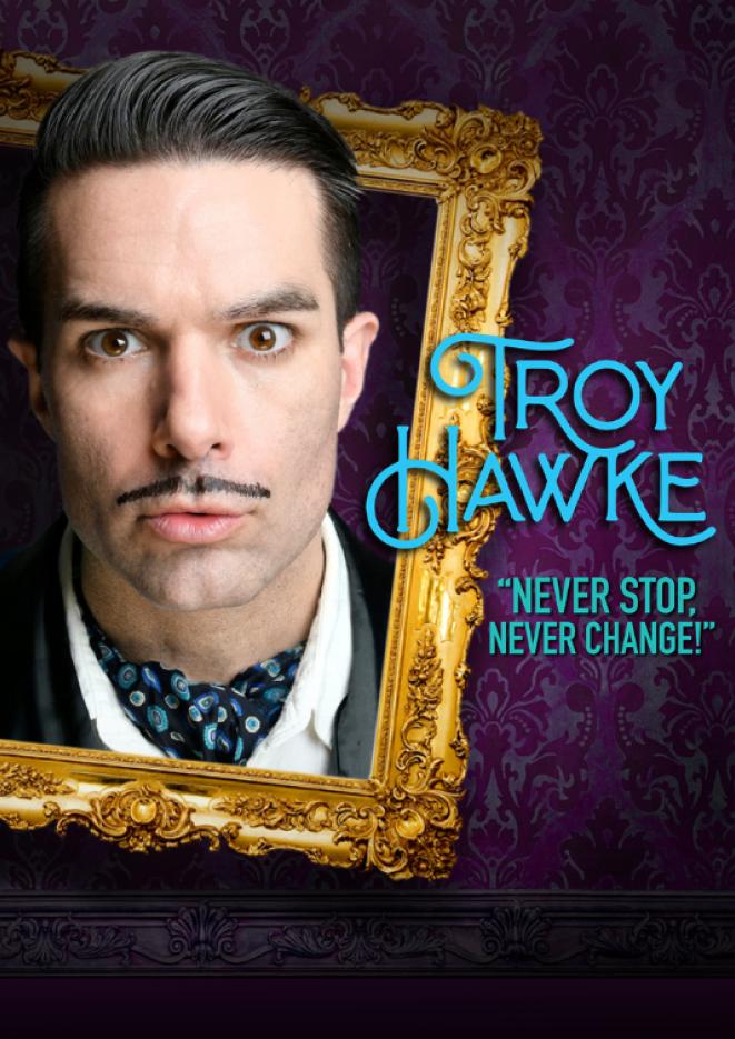 A close up of comedian Troy Hawke in a gold frame against a dark purple background. Text on the right reads Troy Hawke, Never Stop, Never Change.