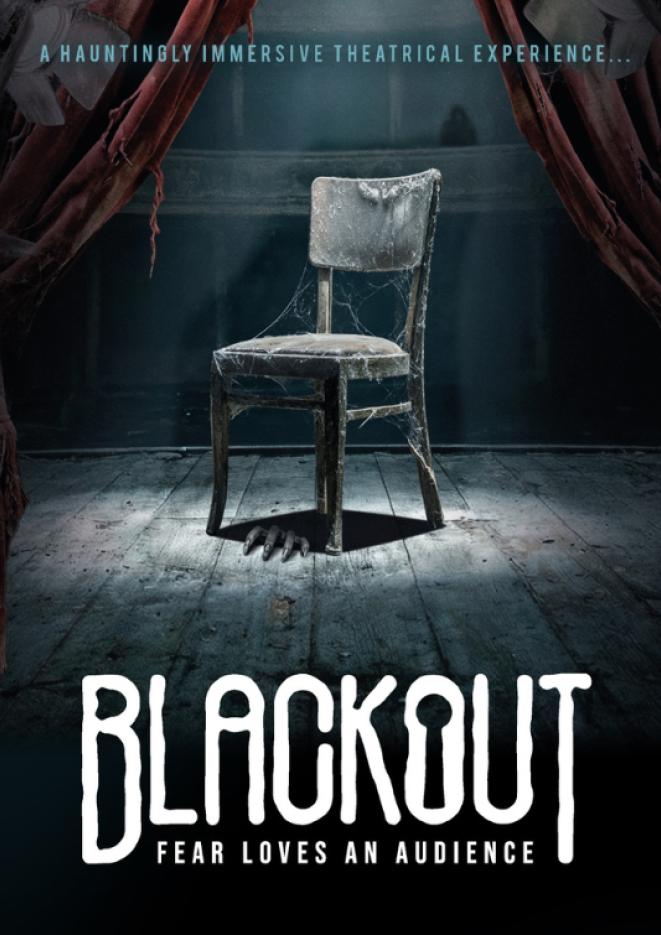 An image of a single chair with a spotlight shining down on it, white text below reads Blackout.