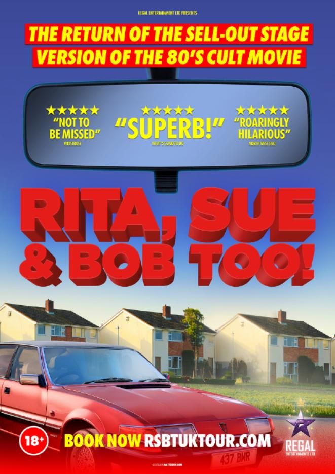 A red car parked in front of some suburban houses, with a rear view mirror at the top of the image.