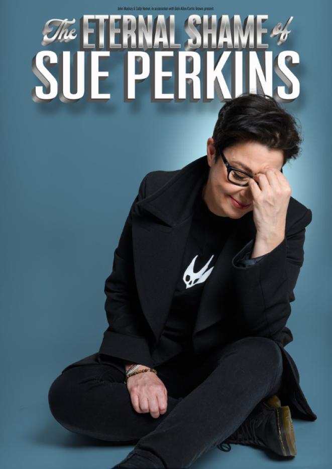 Sue Perkins wears a black suit jacket and sits on the floor with her head in her hands, in front of the words "The Eternal Shame of Sue Perkins"