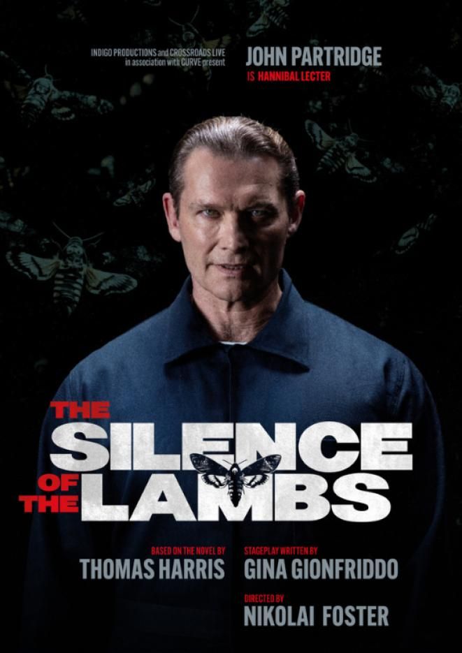 Actor John Partridge looks into the camera, wearing a blue prison jumpsuit. White text at the bottom reads The Silence of the Lambs.