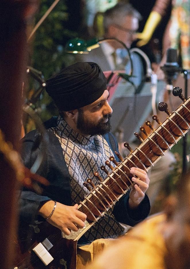 An image of a man playing an instrument.