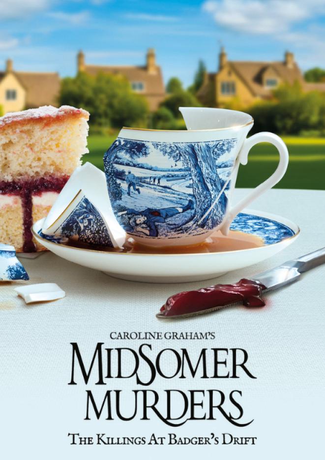 A broken china cup sits on a table next to some cake and a knife with jam on. Against a countrysdie setting.