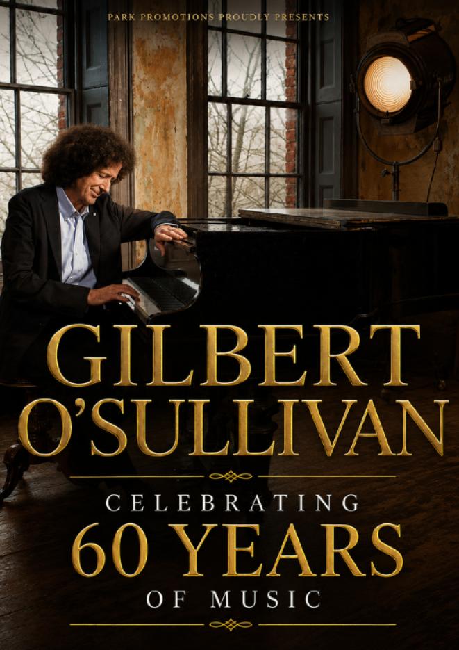 Musician Gilbert O'Sullivan sits at a piano next to two large windows. Gold text over the top reads Celebrating 60 Years of Music.