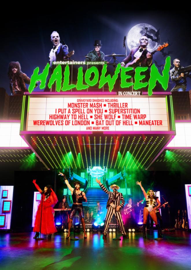 People dressed up in Halloween outfits perform on stage, above them text reads Halloween in Concert.